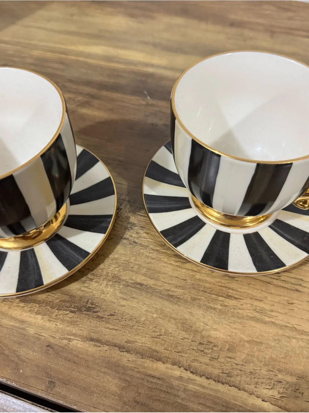 MacKenzie-Childs Black and White Striped Gold-Trim Teacup and Saucer Set pair